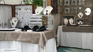 10 product display table ideas and examples show you how to design a vendor booth that stands out and attracts more customers at your next craft show.