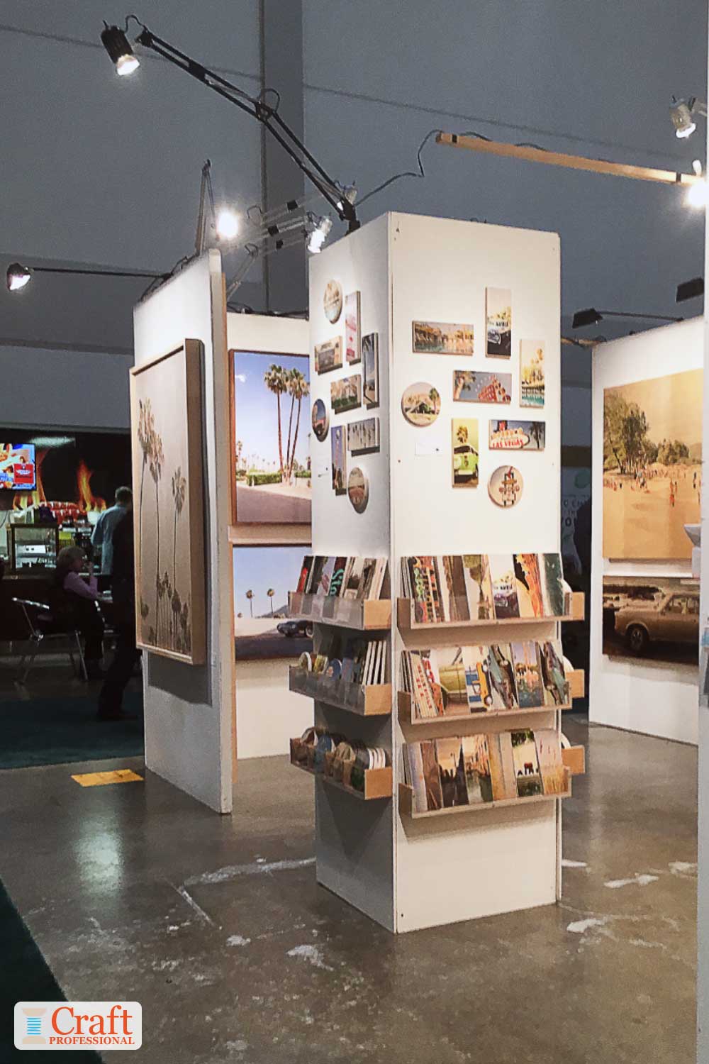 Art show display with overhead lighting Art show display with overhead lighting