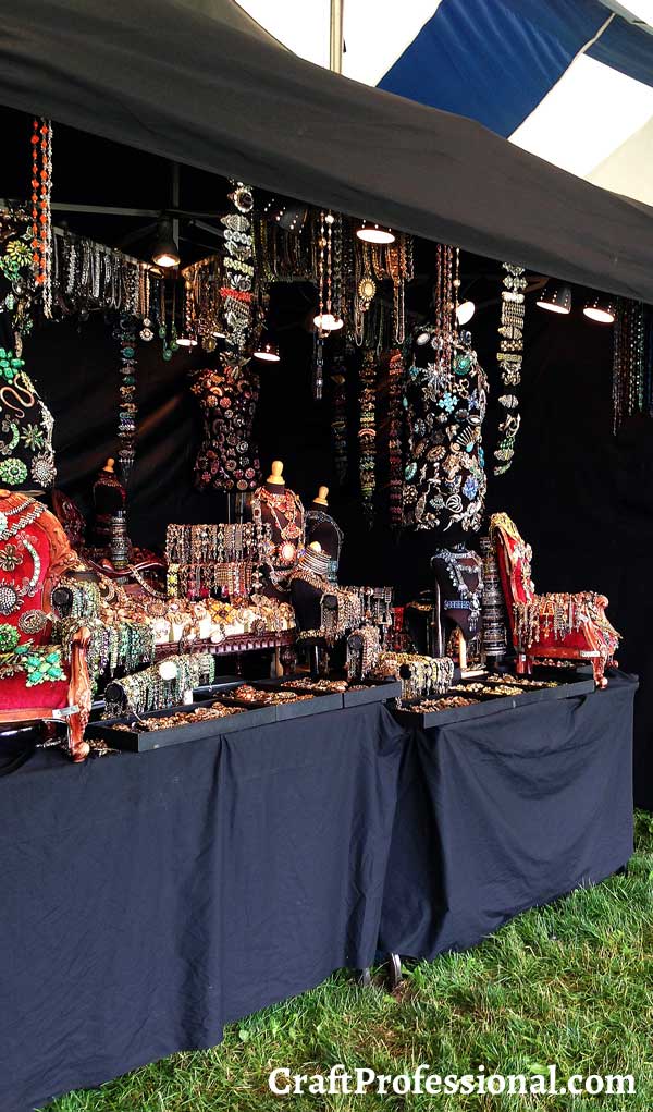 An all-black jewelry booth
