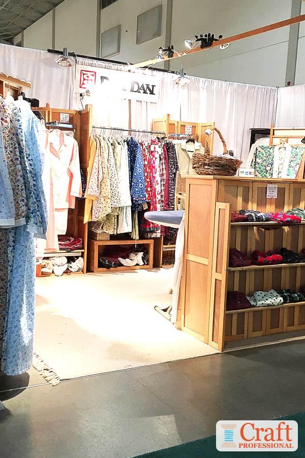 Handmade clothing in a craft show booth