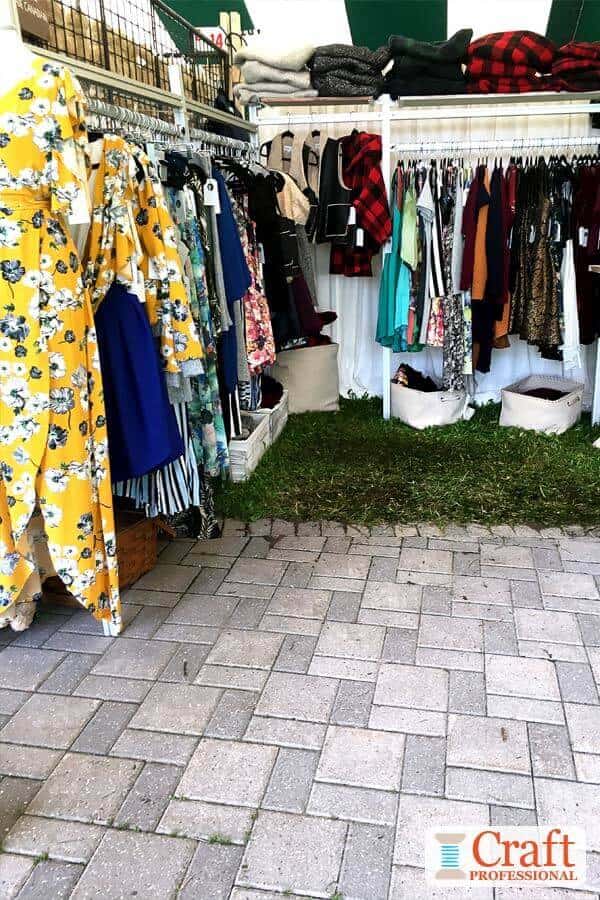 Colorful clothing display at a craft fair