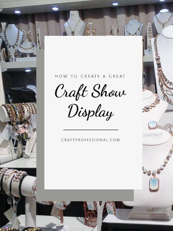Handmade jewelry at a craft fair. Text - How to create a craft show display. Handmade jewelry at a craft fair. Text - How to create a craft show display.