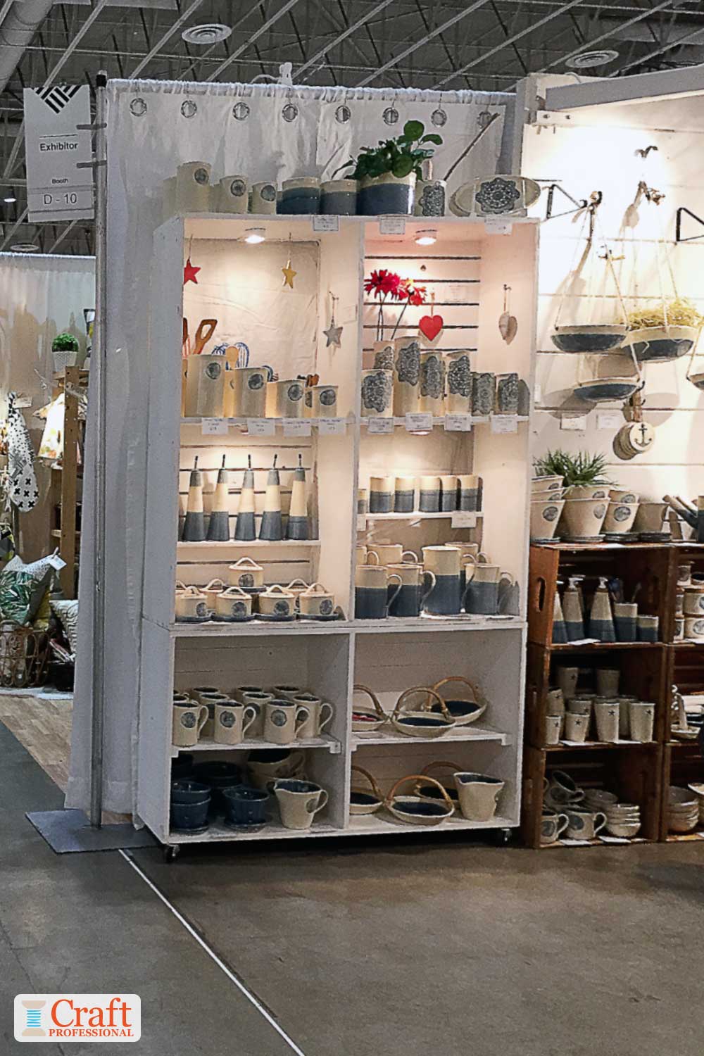 Handmade pottery displayed in a craft show booth Handmade pottery displayed in a craft show booth