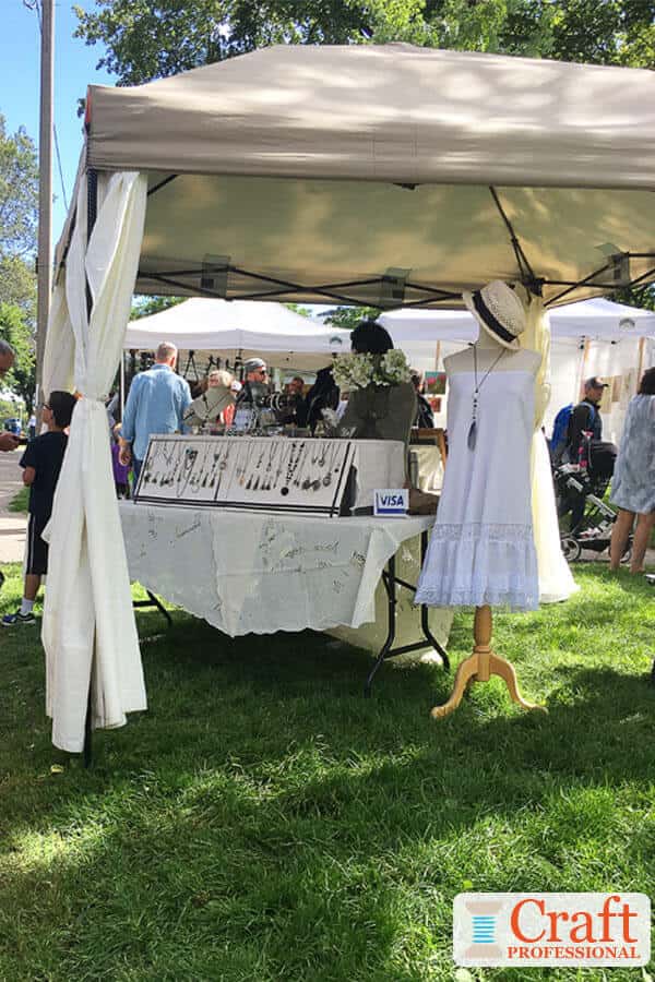 Tabletop jewelry display at an outdoor craft show. Tabletop jewelry display at an outdoor craft show.