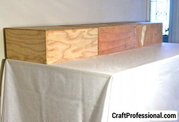 Three custom made display risers on a table.