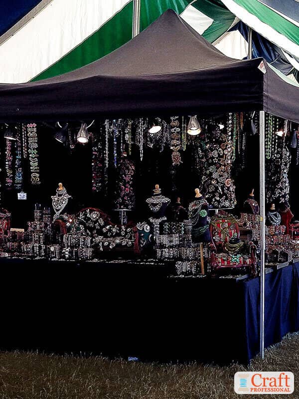 All-black jewelry booth at a craft show All-black jewelry booth at a craft show