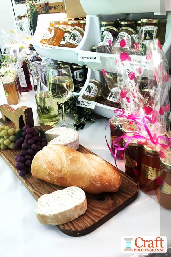 Handmade jellies on a tabletop display at a craft show. Handmade jellies on a tabletop display at a craft show.