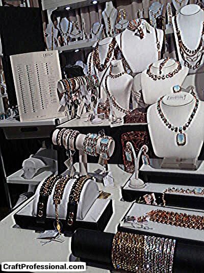 Handmade jewelry on a tabletop display at a craft show Handmade jewelry on a tabletop display at a craft show