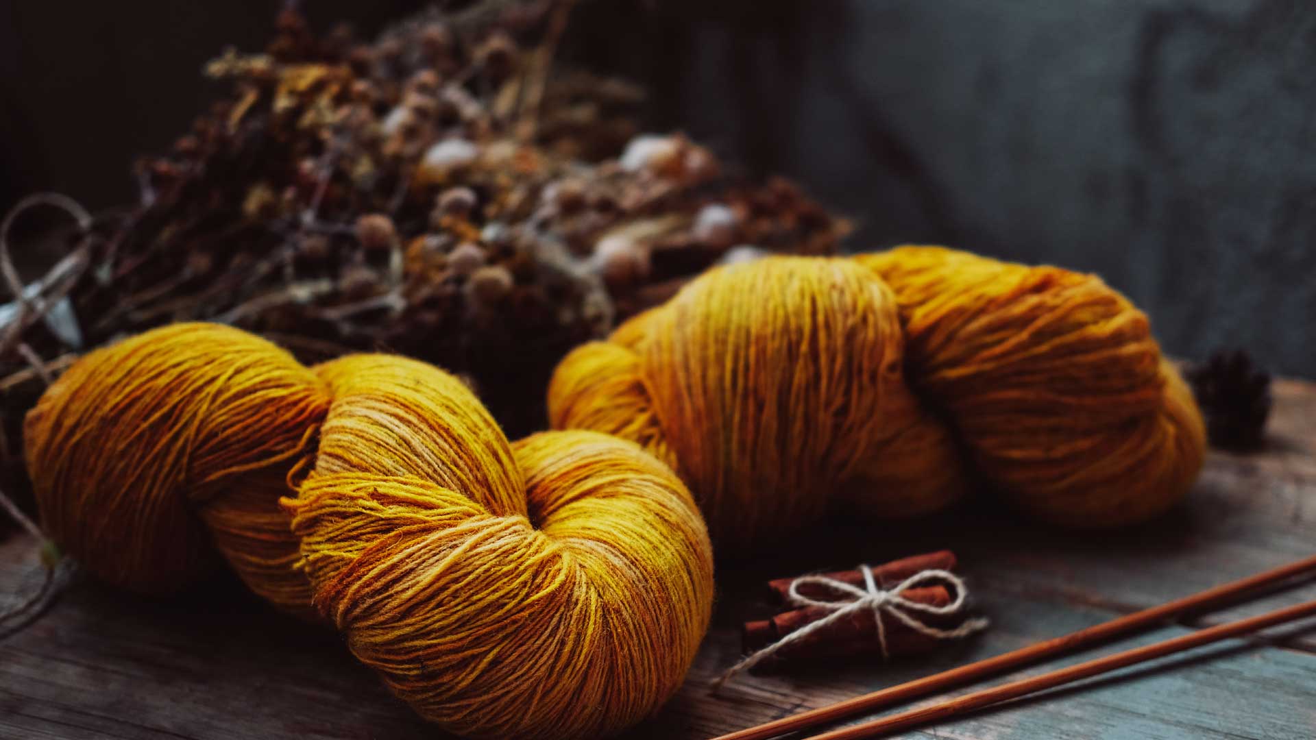 Rich yellow yarn on wood table