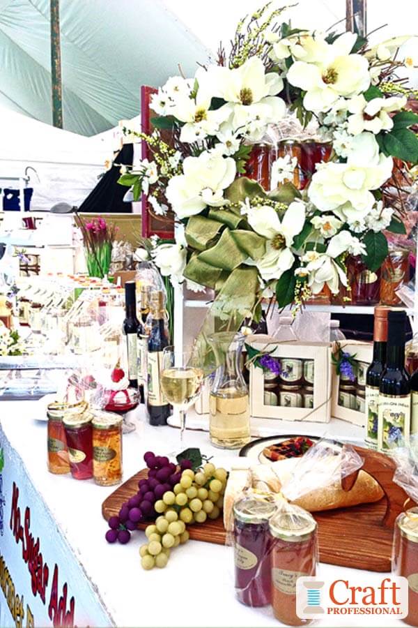 Handmade jellies on a tabletop display at a craft fair. Handmade jellies on a tabletop display at a craft fair.
