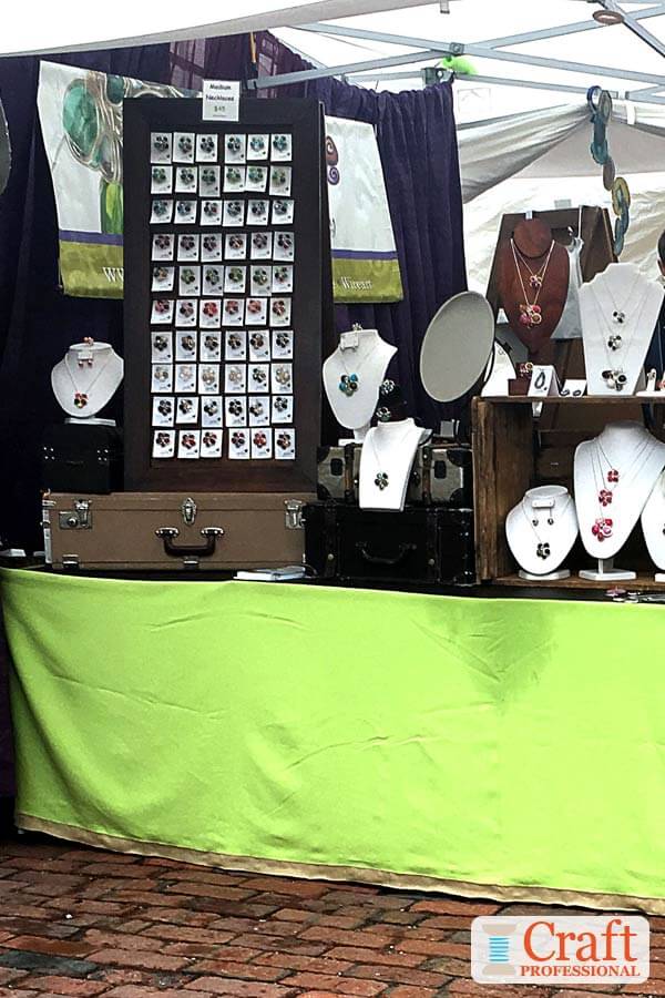 Handmade jewelry displayed at a craft show. Handmade jewelry displayed at a craft show.