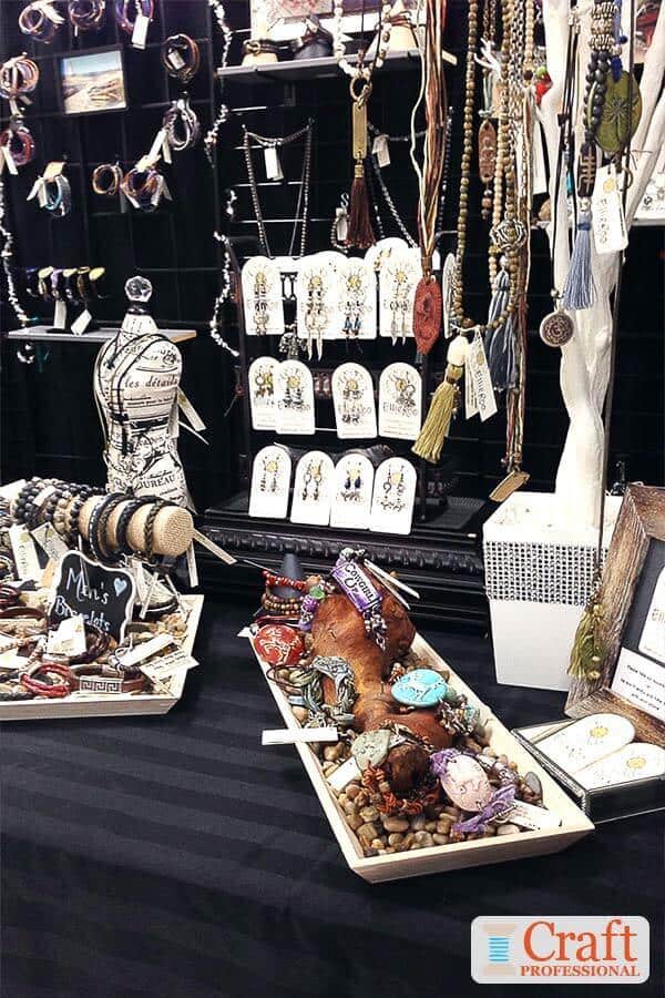 Craft show booth brimming with sparkling handmade jewelry Craft show booth brimming with sparkling handmade jewelry