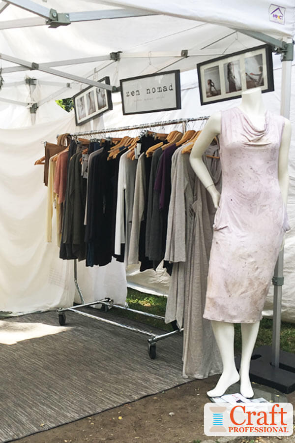 Handmade clothing display at a craft show. Handmade clothing display at a craft show.