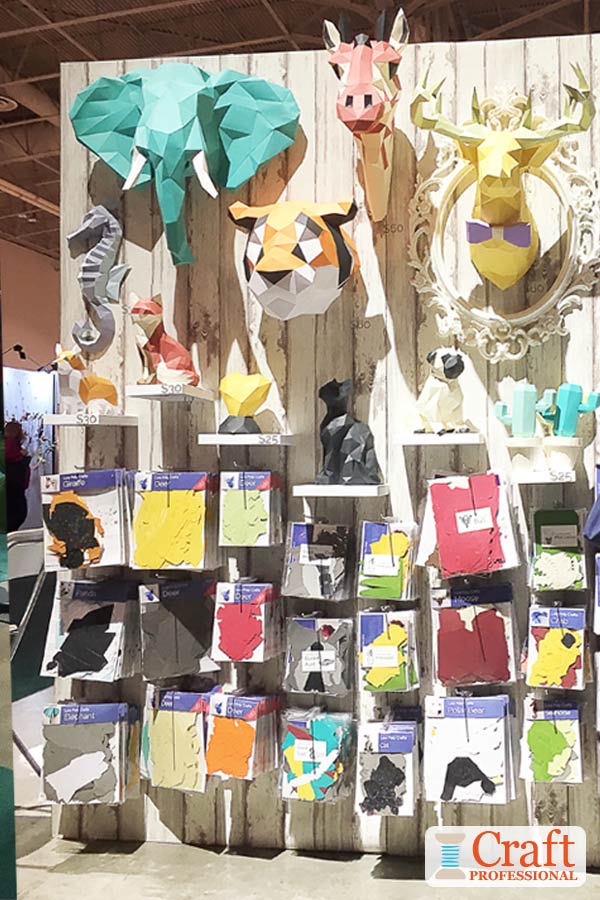 If your handmade product is unique, your display must clearly demonstrate to shoppers what it is and how to use it. Click through for 6 more craft show booth photos. Handmade 3D paper animal heads on display at a craft show.