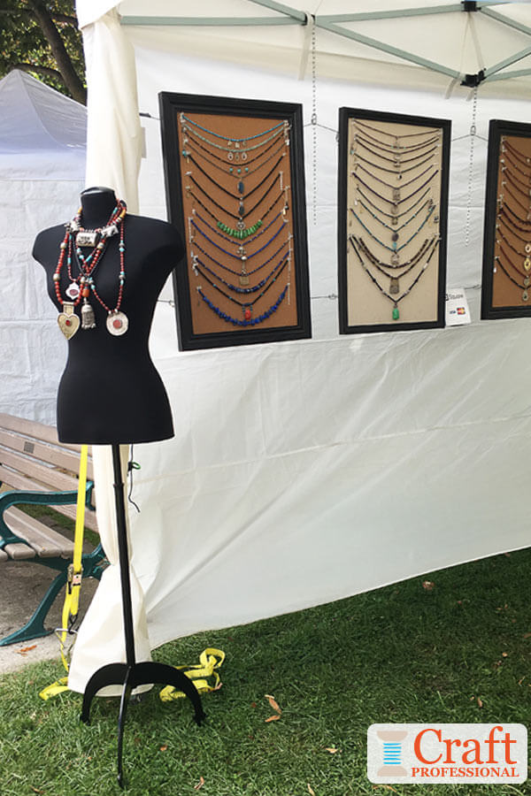 Necklaces displayed on large hanging frames Necklaces displayed on large hanging frames