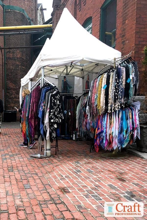 Clothing display booth at an outdoor craft show