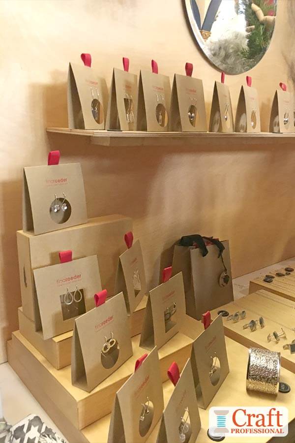 Handmade jewelry displayed at a craft show. Handmade jewelry displayed at a craft show.