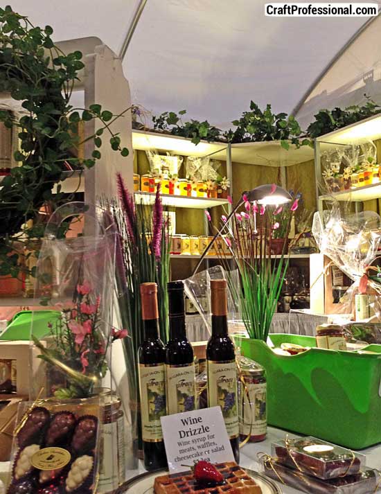 Handmade jams and sauces on a tabletop display at a craft show. Handmade jams and sauces on a tabletop display at a craft show.