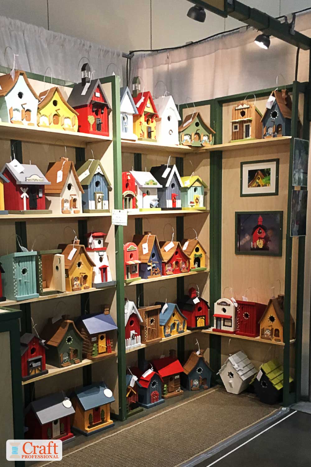 Birdfeeders displayed on shelves at a craft show Birdfeeders displayed on shelves at a craft show