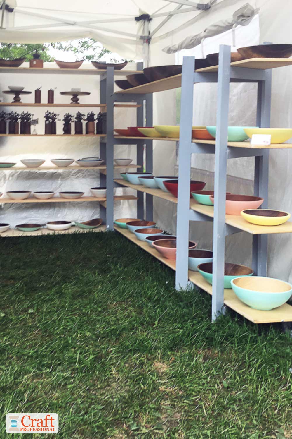 Portable display shelves at a craft show Portable display shelves at a craft show