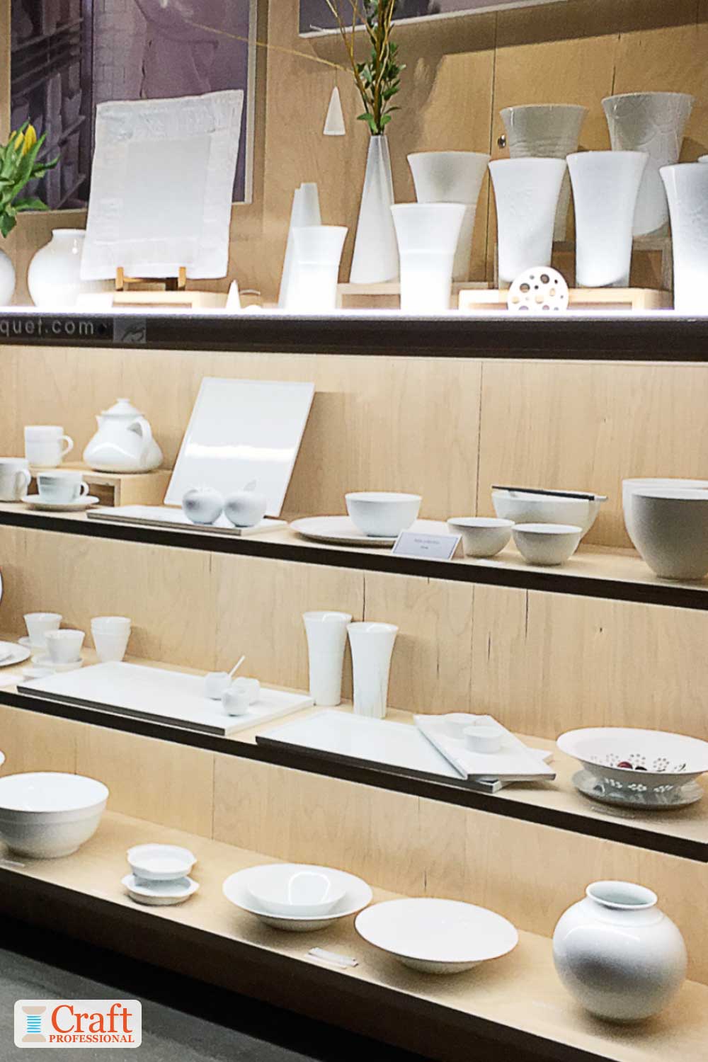 Tableware in a well-lit display on shelves. Tableware in a well-lit display on shelves.