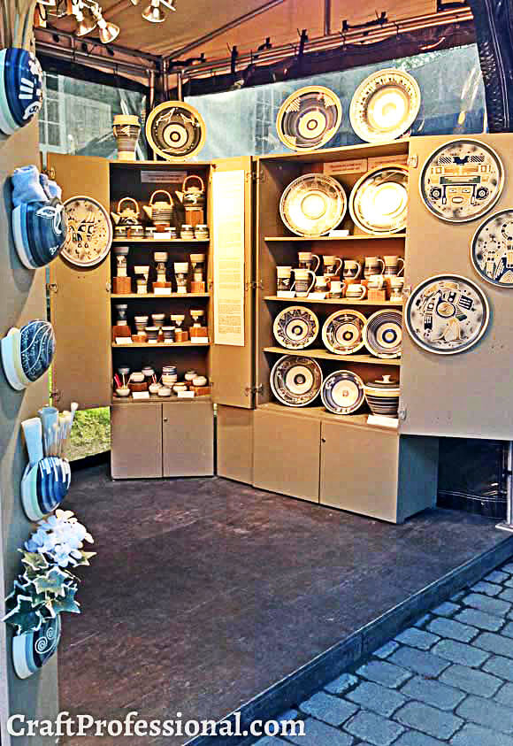 Handmade pottery displayed in a semi-permanent kiosk