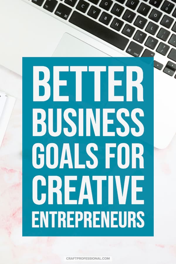 White laptop on desk. Text - Better business goal setting for creative entrepreneurs. White laptop on desk. Text - Better business goal setting for creative entrepreneurs.