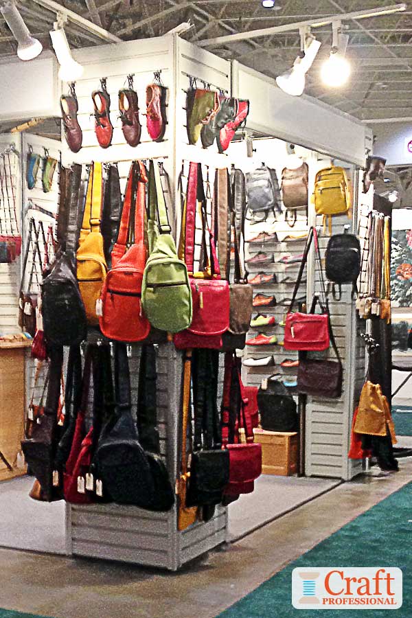 Handmade accessories displayed on slat walls